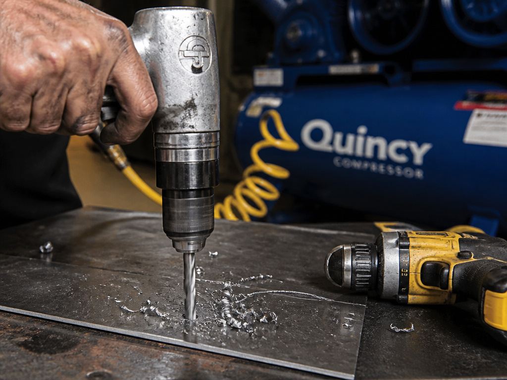 Comparing a 3/8 inch pneumatic drill vs a 1/2 inch cordless drill in a metal shop.