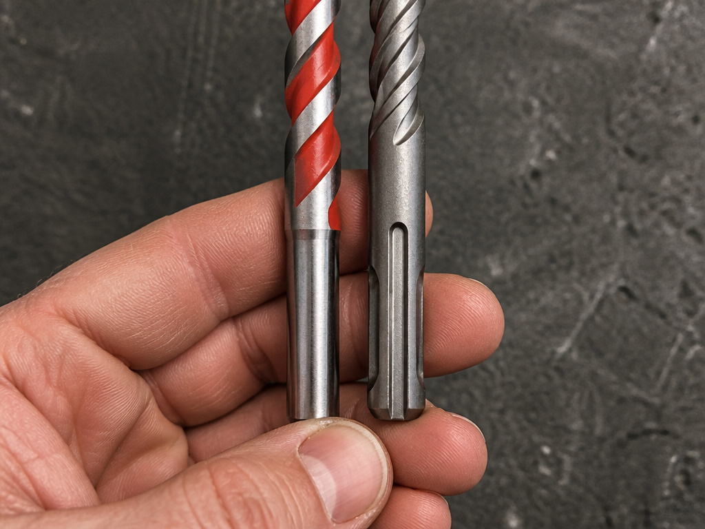Comparison of a round shank masonry drill bit versus an SDS-plus bit for concrete.