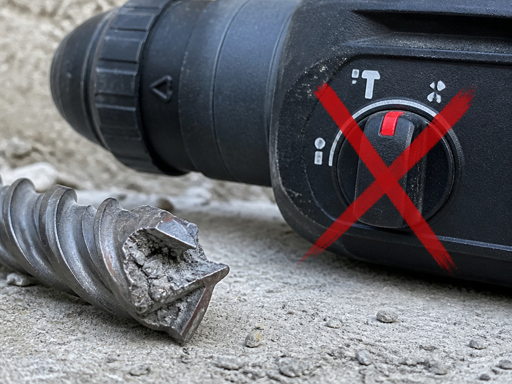 Broken masonry drill bit from misuse in hammer mode on concrete
