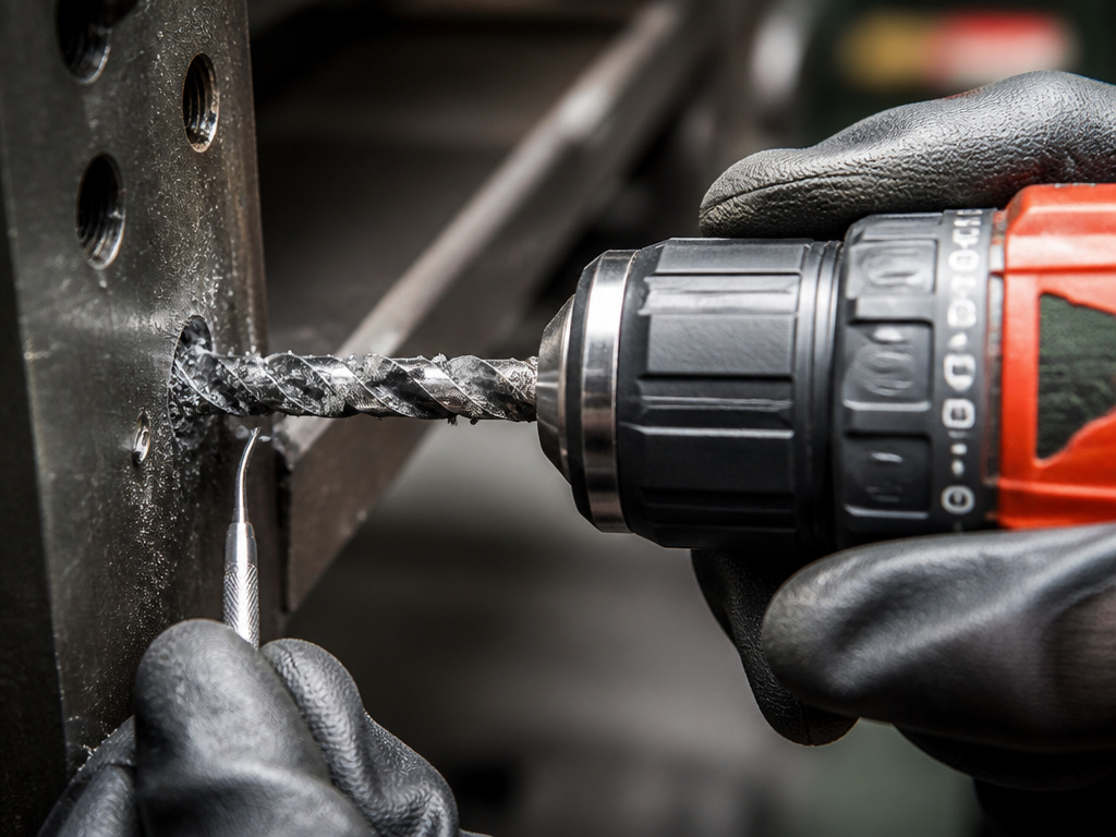 Troubleshooting a bound left-hand drill bit in metal with forward rotation